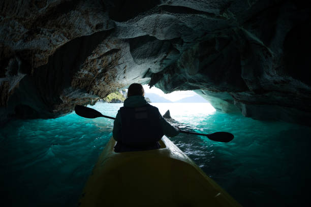 istock Woman paddles kayak 1084477192