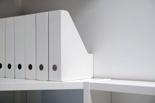 istock Office folders for documents. A folder with files on the sideboard in a bright modern office, archive and documents 1084477612