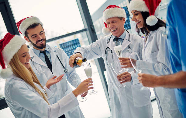 istock Group of doctors celebrating Christmas 1084479358