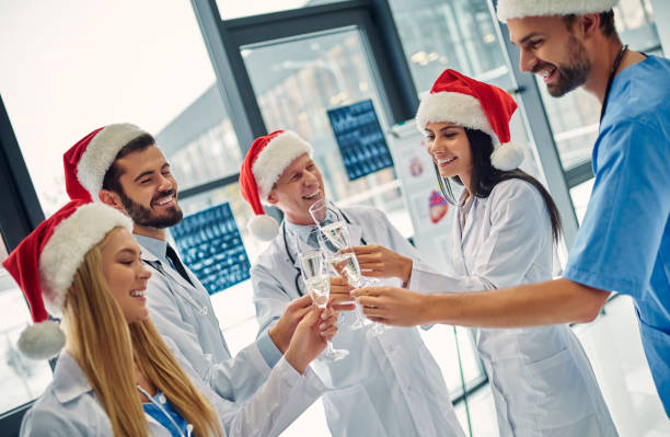 istock Group of doctors celebrating Christmas 1084479420