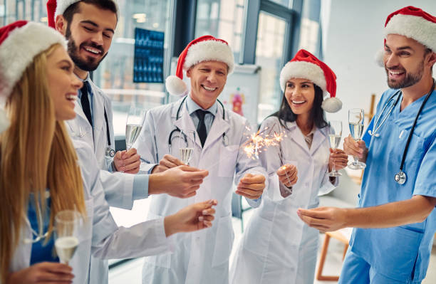 istock Group of doctors celebrating Christmas 1084479422