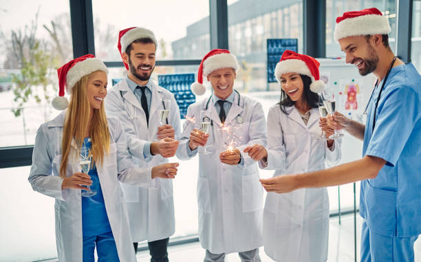 istock Group of doctors celebrating Christmas 1084479430
