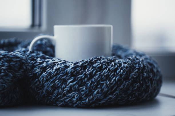 istock Cup off coffee and knitted scarf 1084479704