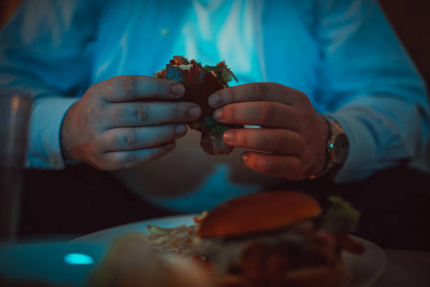Man holding hamburger