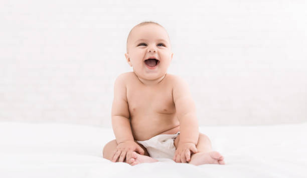 istock Cute baby sitting on white background, copy space 1084486312