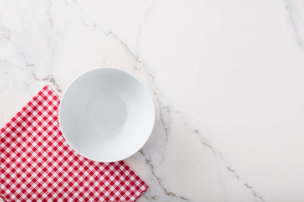 istock White soup bowl on marble kitchen countertop. 1084488304
