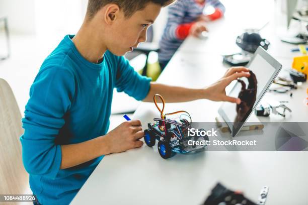 Building Robotic Car For School Assignment Stock Photo - Download Image Now - Education, Child, Robot