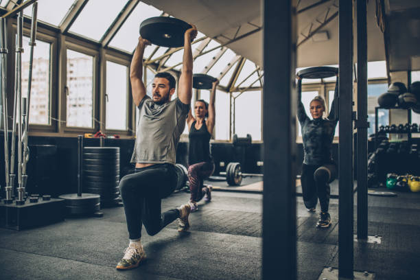 istock Women training together with personal trainer in gym 1084490268