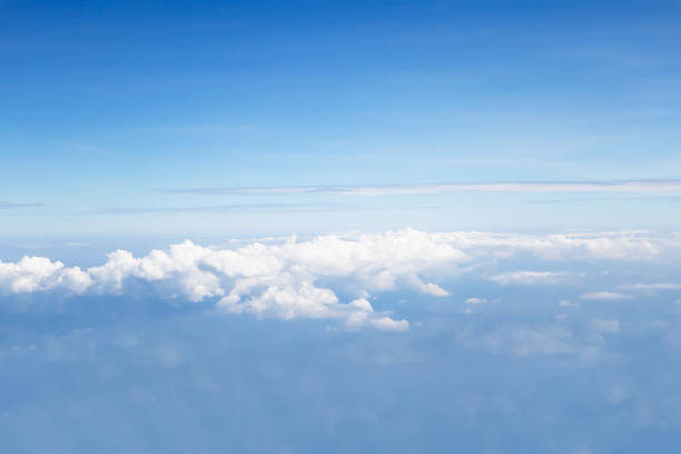 istock Dramatic atmosphere panorama view of beautiful blue sky and soft white clouds from aircraft. 1084490336