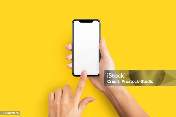 Mockup Of Female Hand Holding Cell Phone With Blank Screen Stock Photo - Download Image Now