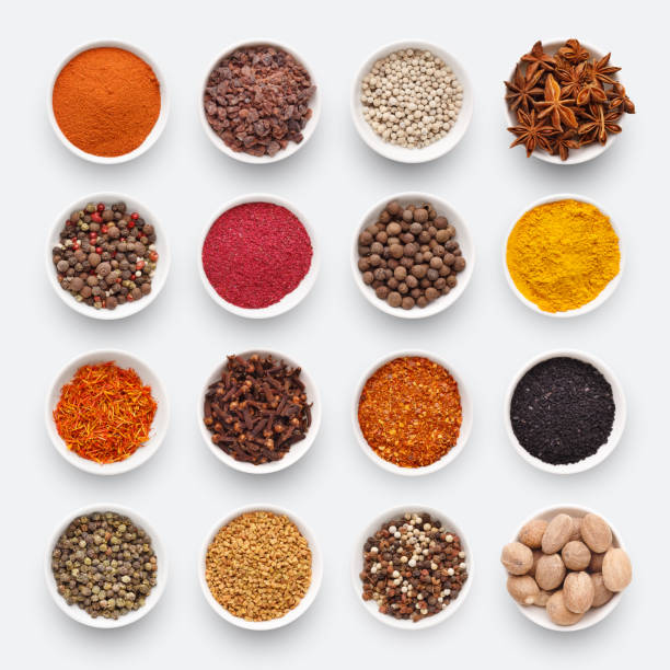 istock Different kinds of spices on white background 1084497588