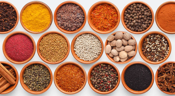 istock Different kinds of spices on white background 1084497608