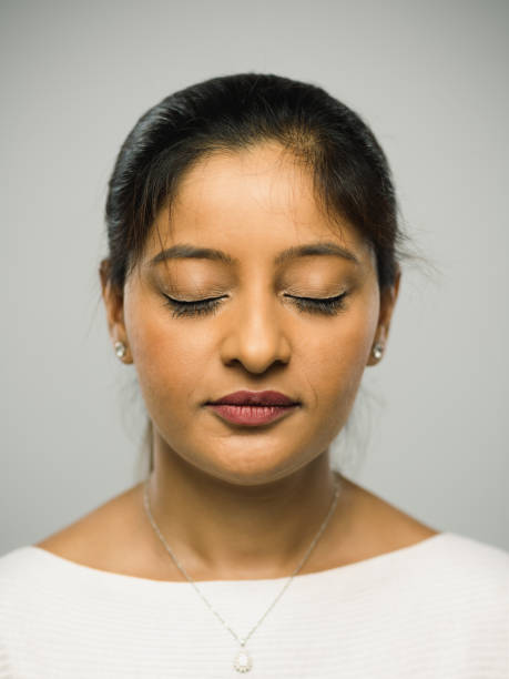 istock Real indian young woman with blank expression and closed eyes 1084498118