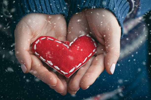 istock Female hands giving red heart. Close up. 1084500964