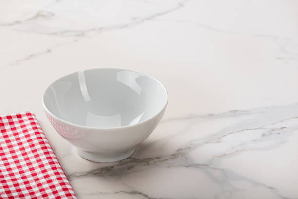 istock White soup bowl on marble kitchen countertop. 1084501214