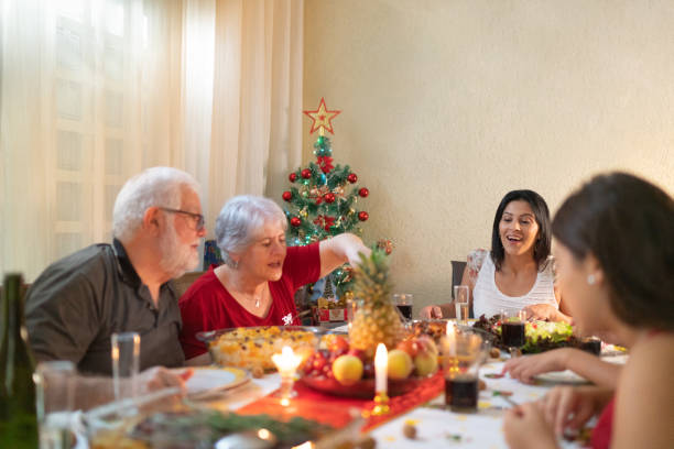 istock Family Having Dinner Together Celebrating Christmas Time 1084505668