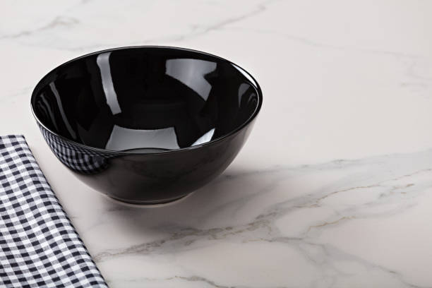 istock Black soup bowl on marble kitchen countertop 1084505818