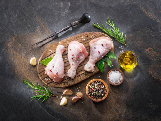 istock Chicken legs with spices and salt  ready for cooking. 1084511618