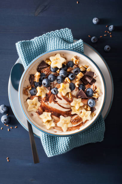 istock healthy banana smoothie bowl with blueberry chocolate walnuts 1084511636