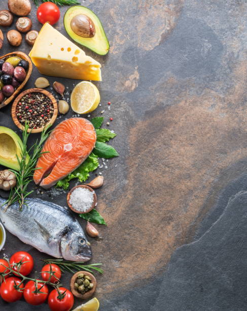 istock Raw dorado fish and salmon steak with spices and vegetables. 1084512082