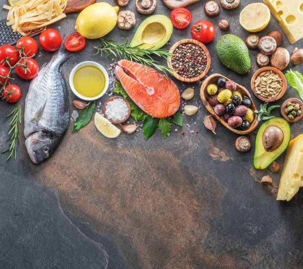 istock Raw dorado fish and salmon steak with spices and vegetables. 1084512284