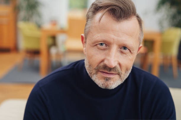 istock Thoughtful bearded man staring intently at camera 1084516026