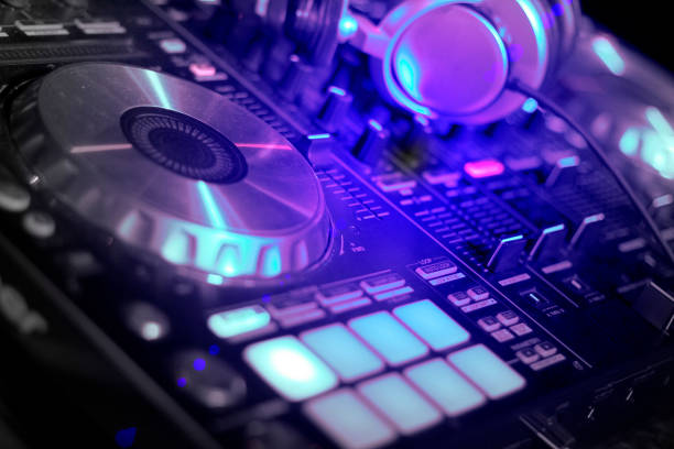 istock Headphone and DJ control gear, electronic night party 1084518494