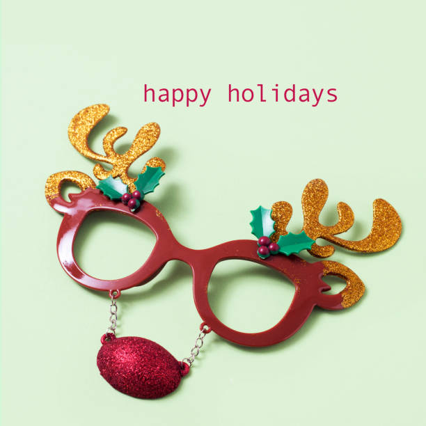 istock reindeer eyeglasses and text happy holidays 1084519154
