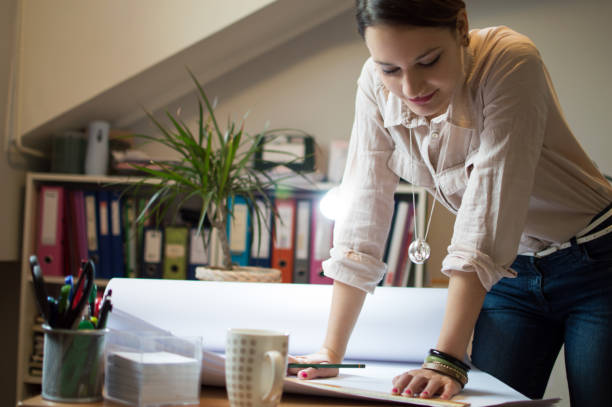 istock Young woman working in her office 1084521940