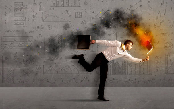 istock Running business man with fire laptop 1084529516