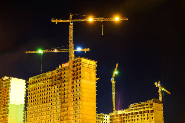 istock House construction. Night snapshot. Tower crane. 1084533080
