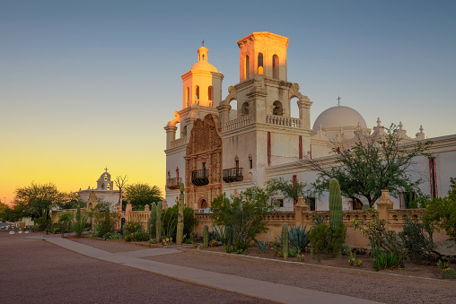 Sunrise at the San Xavier Mission Church in Tucson, Arizona. This historic spanish catholic mission was founded in 1692 and is located on the Tohono O'odham Nation indian reservation.