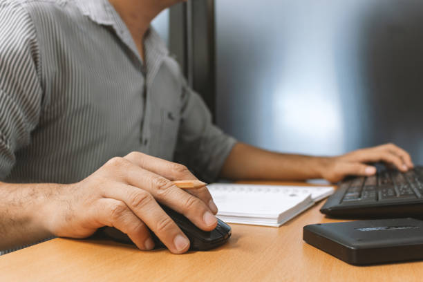 istock businessman working in office with soft-focus and over light in the background 1084540640