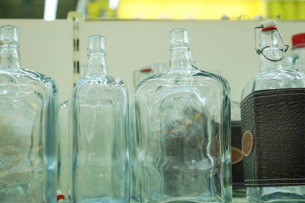 istock Empty glass bottles in factory to fill with drink 1084544774