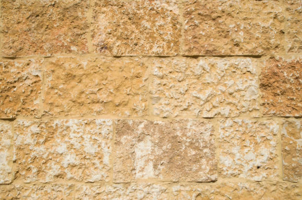 istock New wall of relief orange  limestone closeup 1084544946