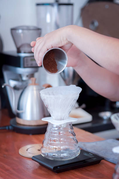 istock Barista hand pouring fresh roasted coffee 1084545180