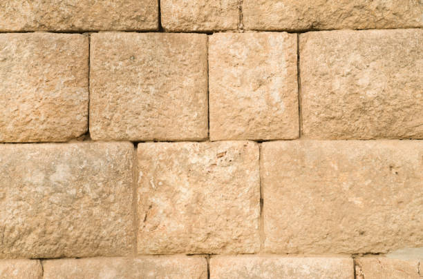 istock Old relief yellow limestone closeup 1084545218