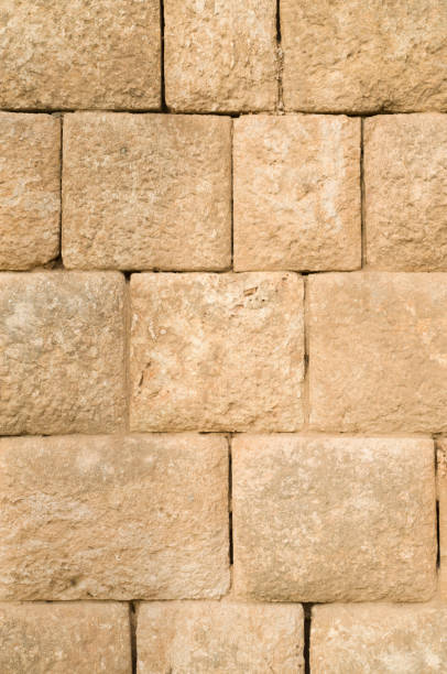 istock Old relief yellow limestone closeup 1084545220