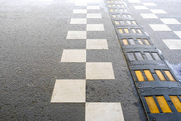 istock Traffic safety speed bump on an asphalt road 1084549660