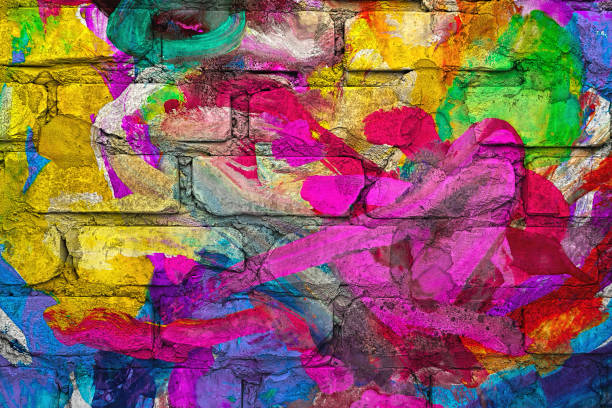 istock Abstract  painting on brick wall. Multi colored brush strokes gouache paint 1084551854