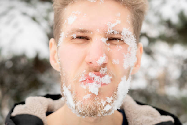 istock frozen cold bearded man face outdoors, winter season f 1084554496