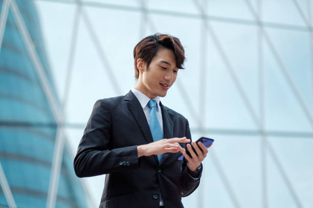 istock Young businessman using his smartphone on the street 1084554838