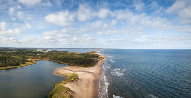 PEI Aerial Aerial panoramic view of a beautiful sandy beach on the Atlantic Ocean. Taken in Cavendish, Prince Edward Island, Canada. cavendish beach stock pictures, royalty-free photos & images