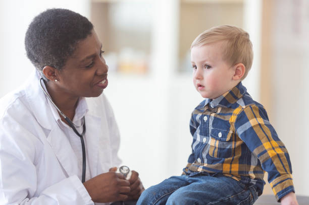 istock Doctor giving a little boy a check up 1084557060