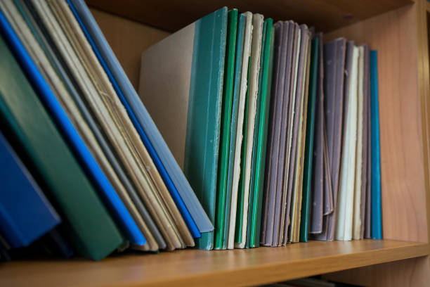 istock Bookshelf in library with many books. 1084561462
