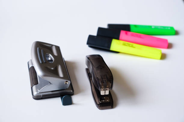 istock Stapler, hole punch and markers on a white background 1084563116