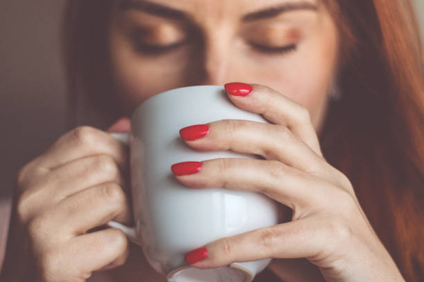 istock Young woman enjoying morning coffee 1084563476