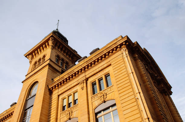istock Old buildings tower near Neuchatel pier against sky 1084568088