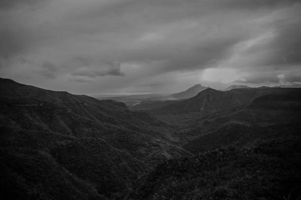 istock panoramic mountain scene with several layers in black and White 1084568876