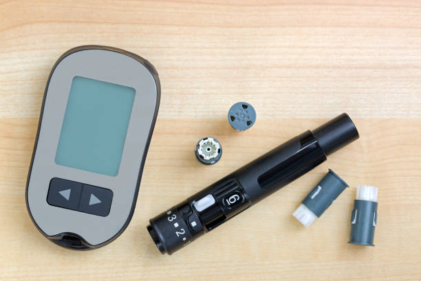 istock Blood Glucose meter with finger pricker, lancing pen device kit with drum to check blood Glucose 1084569806